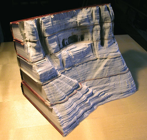 Book sculptures by artist Guy Laramee
