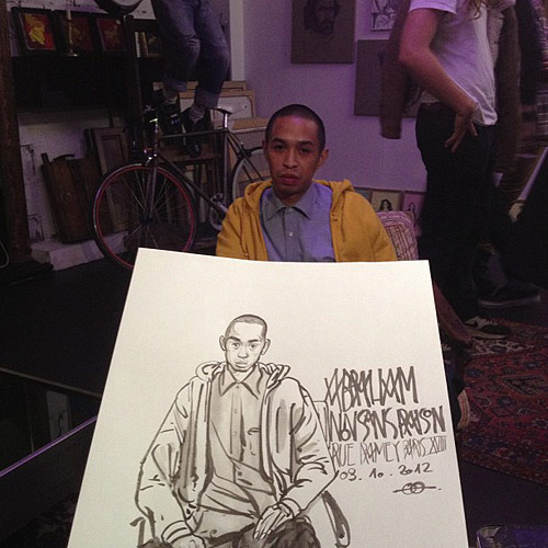 Artist Yue Wu drawing at Le Salon Atelier Galerie